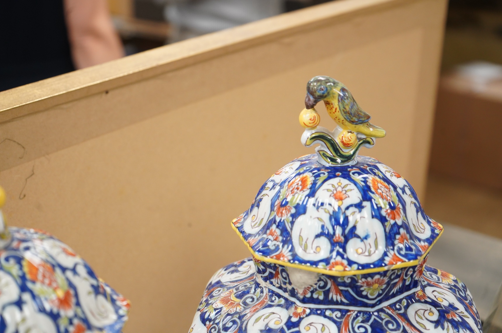 A pair of early 20th century Rouen faience vases and covers, the knops in the form of birds, 49cm high